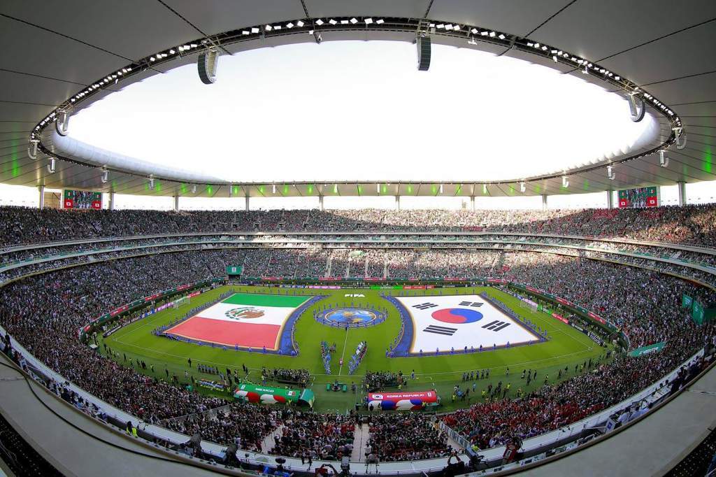 The iconic volcanic structure and floating roof of Estadio Akron in Guadalajara.