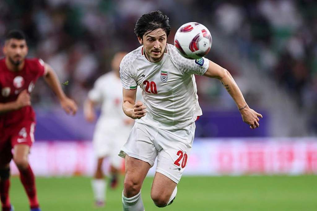 Iranian forward Sardar Azmoun posing for a photograph during an international football match.