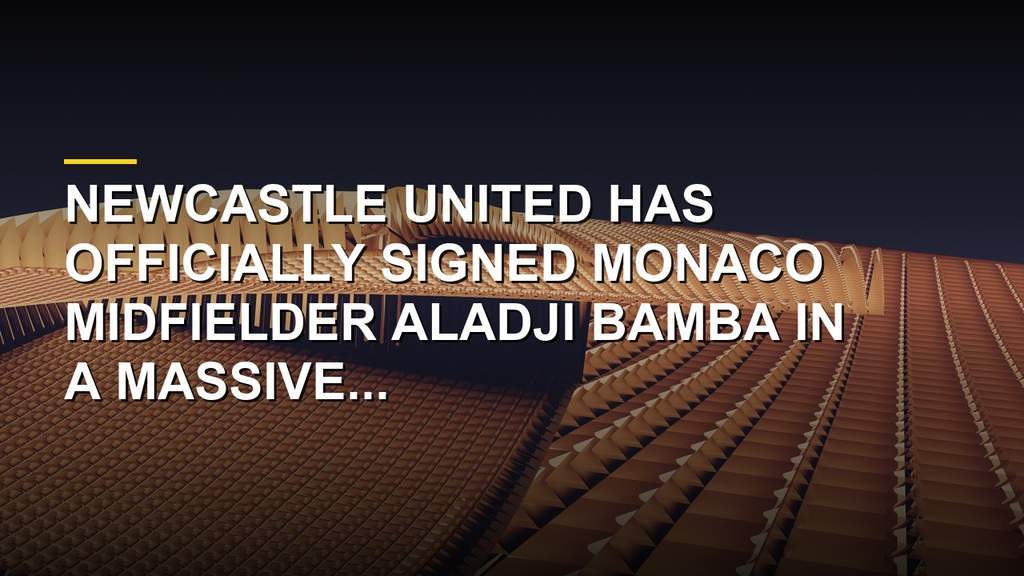 Aladji Bamba poses in a Newcastle United jersey after completing his transfer from Monaco