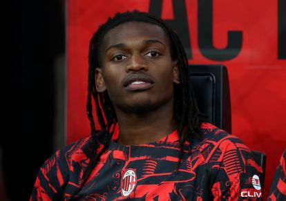 Rafael Leao sitting on the substitutes bench for AC Milan during a Serie A match